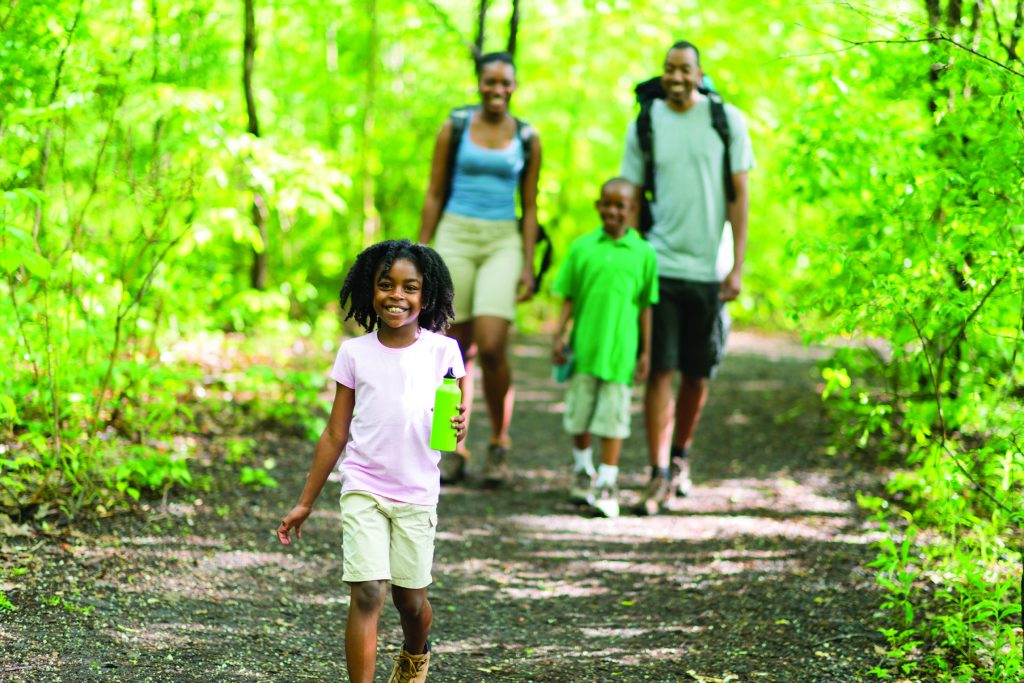 Family with two kids hiking